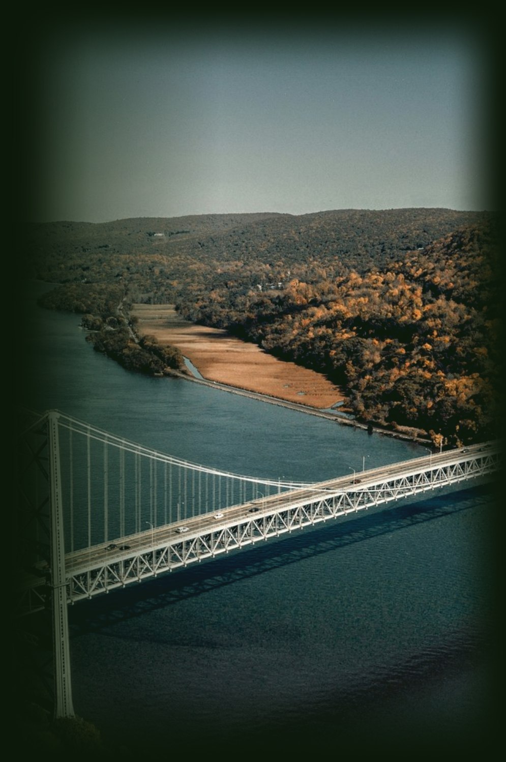 A suspension bridge crossing a river